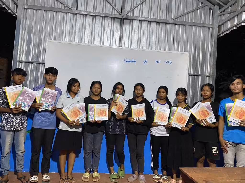 Students receiving books 5